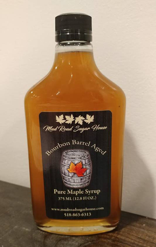 glass bottle of bourbon barrel aged maple syrup