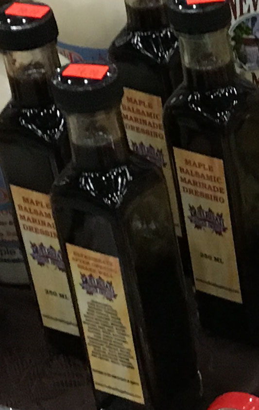 glass bottles of maple dressing